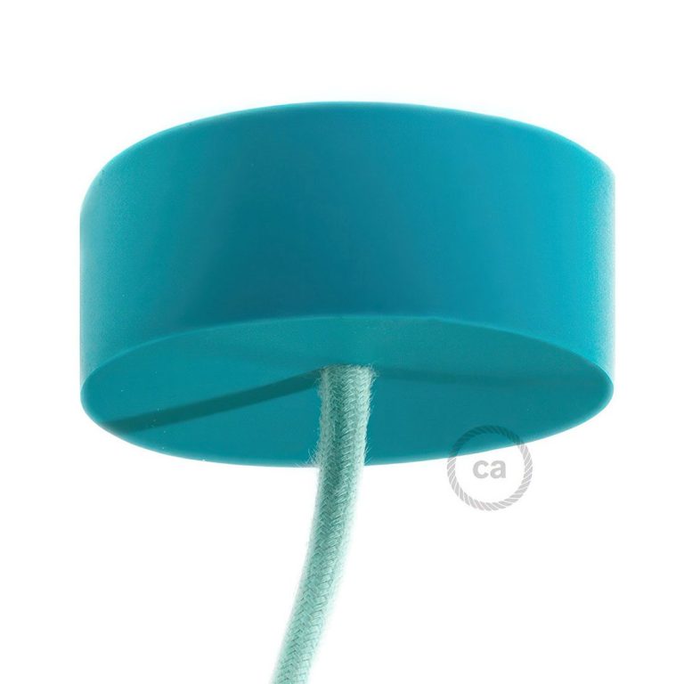 Türkise, runde Kunststoffabdeckung mit einem daran befestigten Kabel.